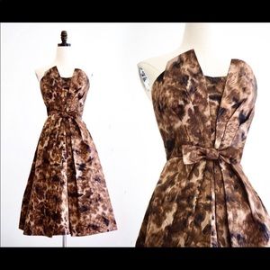 Sculptural 1950s Cocktail dress. Nipped waist and full skirt.  Autumn colors.